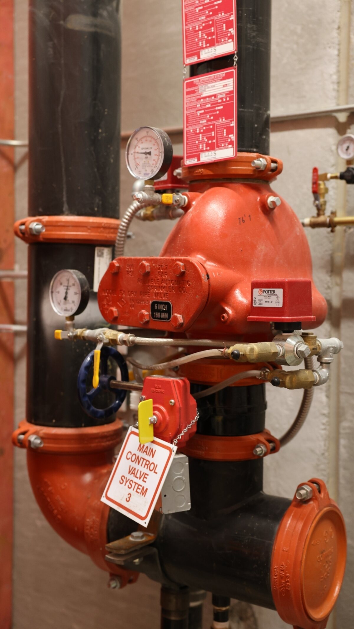 Dry-pipe sprinkler riser with air-maintenance device — Zion-serviced Texas warehouse installation