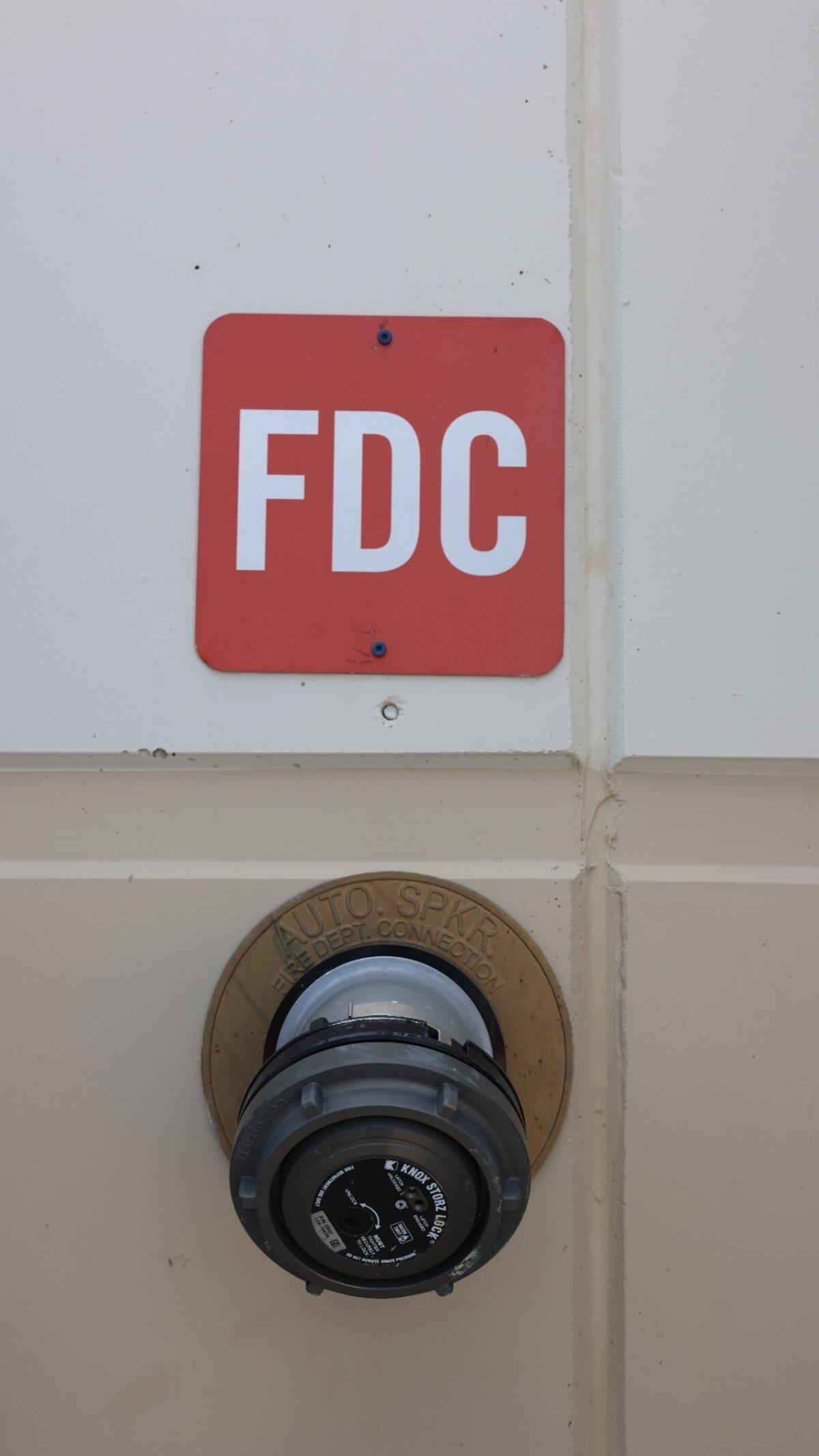 Fire department connection (FDC) with Siamese inlets and caps — Zion-inspected Texas commercial property